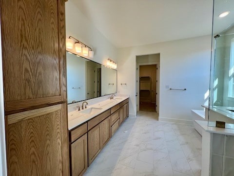 bathroom featuring vanity and a washtub