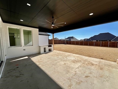 view of patio / terrace featuring ceiling fan