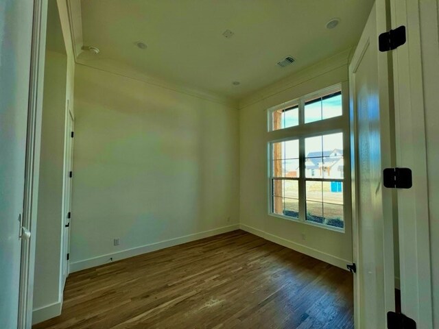 spare room featuring dark wood-type flooring