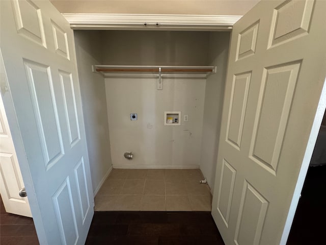 laundry area with dark tile patterned flooring, electric dryer hookup, and hookup for a washing machine