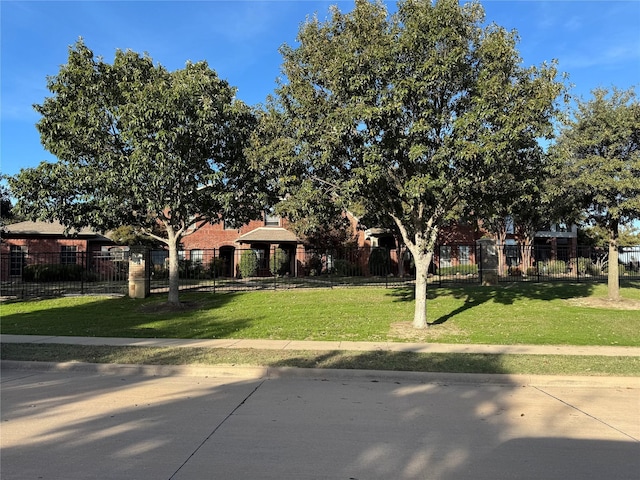 575 S Virginia Hills Dr Unit 105, Mckinney, TX 75072 - obstructed view of property featuring a front lawn