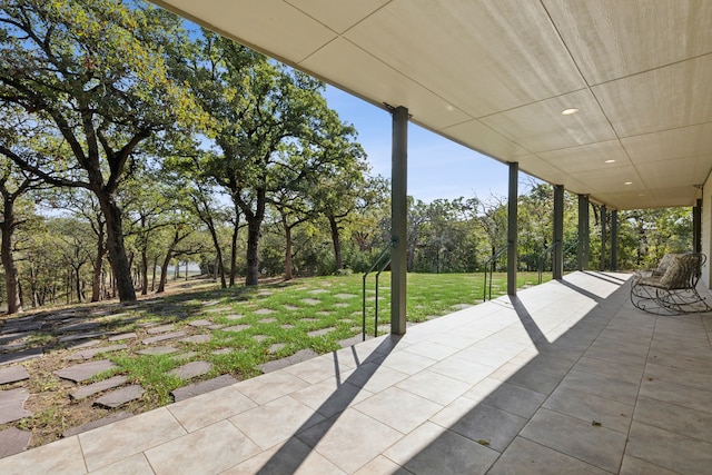 16 Hidden Valley Airpark, Shady Shores, TX 76208 - view of patio with view of wooded area