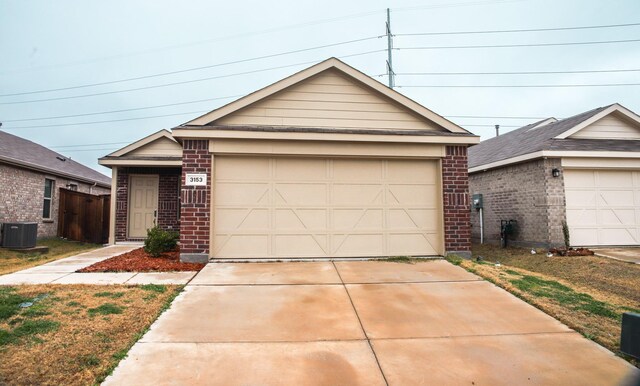 ranch-style house with a front lawn and a garage