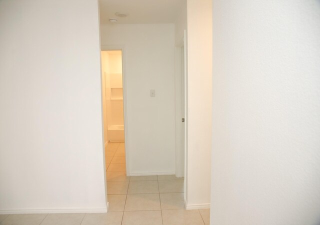 bathroom featuring tile patterned flooring, shower / bath combination, and vanity