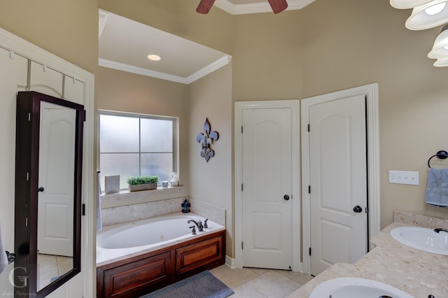 bathroom featuring ornamental molding, vanity, ceiling fan, tile patterned flooring, and a bathing tub