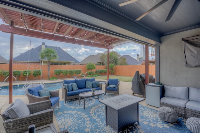 view of patio / terrace featuring an outdoor living space, pool water feature, a fenced in pool, and ceiling fan