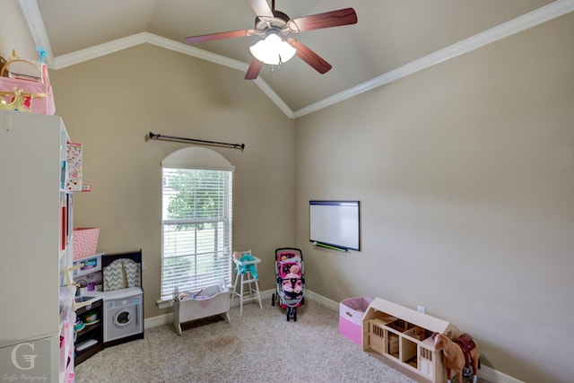 playroom featuring ceiling fan, crown molding, light carpet, and vaulted ceiling