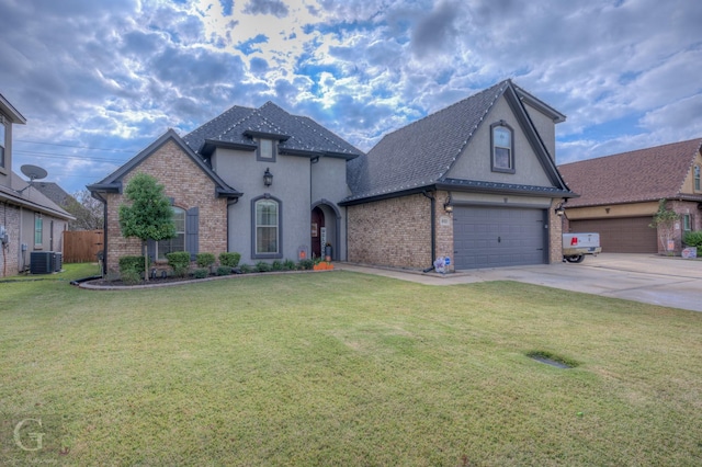 view of front of home featuring central AC and a front lawn