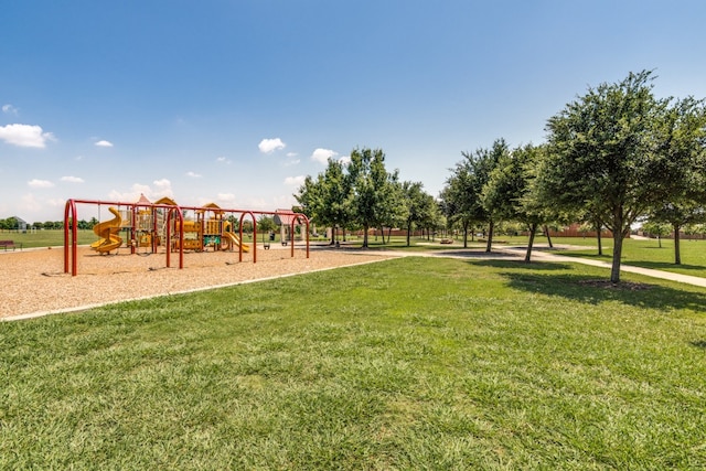 view of jungle gym featuring a lawn