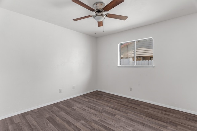 empty room featuring dark wood-type flooring and ceiling fan