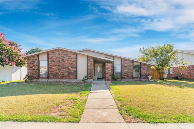 single story home with a front lawn and central AC