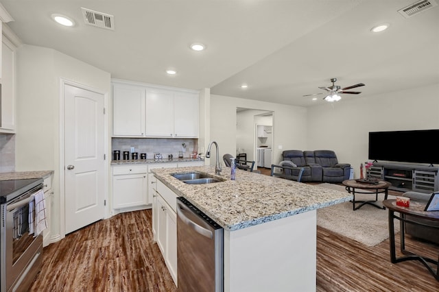 kitchen featuring dark hardwood / wood-style flooring, white cabinetry, sink, and stainless steel appliances