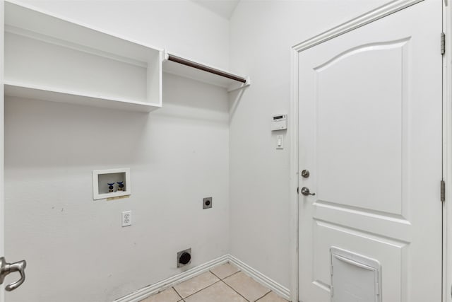 washroom featuring hookup for an electric dryer, hookup for a washing machine, and light tile patterned floors