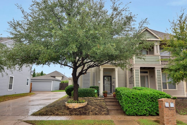 view of front of home with an outbuilding and a garage