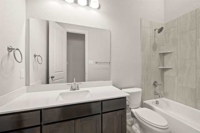 full bath with toilet, a textured wall, washtub / shower combination, and vanity