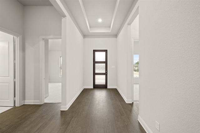 entryway featuring dark wood-style flooring and baseboards