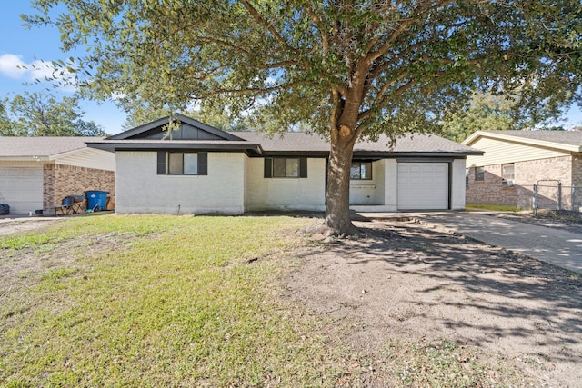 ranch-style house with a front lawn and a garage