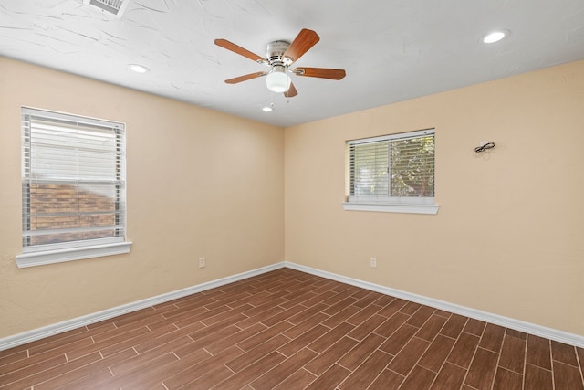 unfurnished room featuring ceiling fan and dark hardwood / wood-style floors