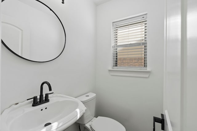 bathroom with sink and toilet