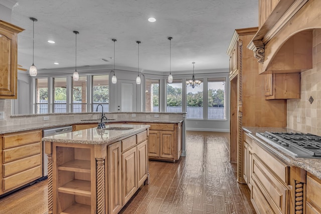 kitchen featuring a kitchen island with sink, dark wood-type flooring, backsplash, and light stone countertops