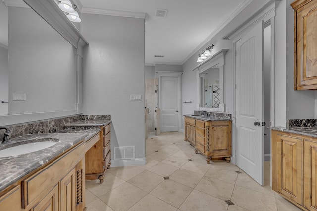 bathroom with vanity, tile patterned floors, and crown molding