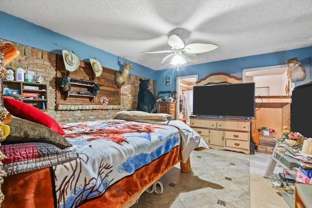 bedroom featuring a textured ceiling and ceiling fan