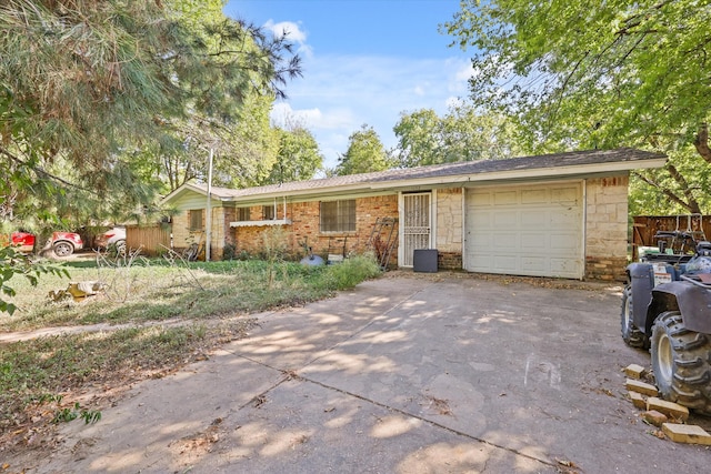 ranch-style house featuring a garage