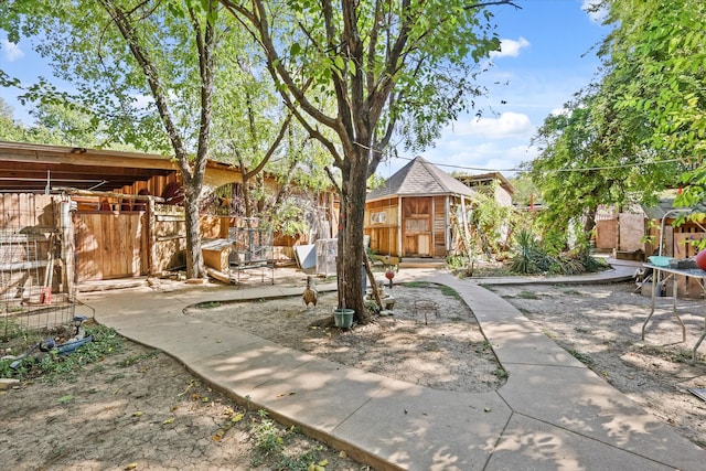 view of patio with an outbuilding