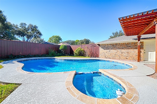 view of pool featuring an in ground hot tub and a patio