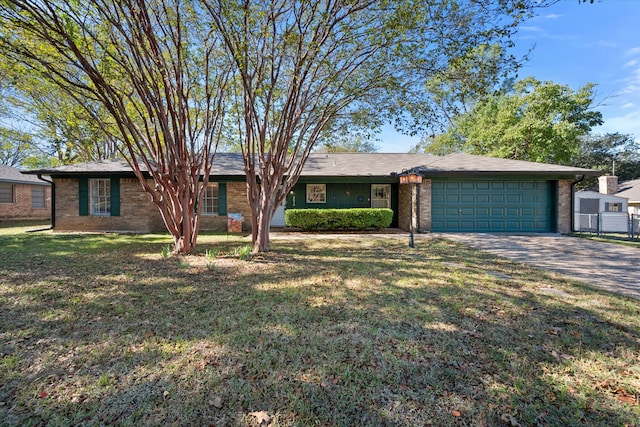 ranch-style home with a garage and a front yard