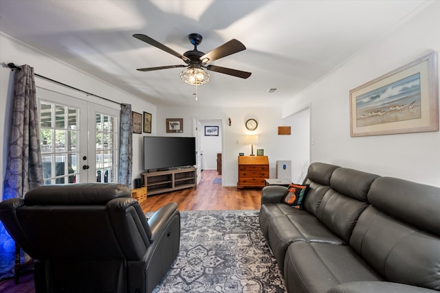 living room with ceiling fan, wood-type flooring, and french doors