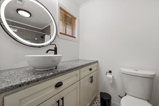 bathroom featuring crown molding, vanity, a shower with shower curtain, and toilet