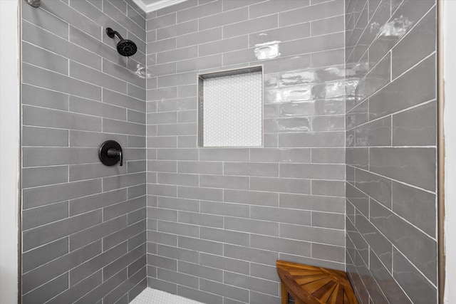 bathroom featuring a tile shower