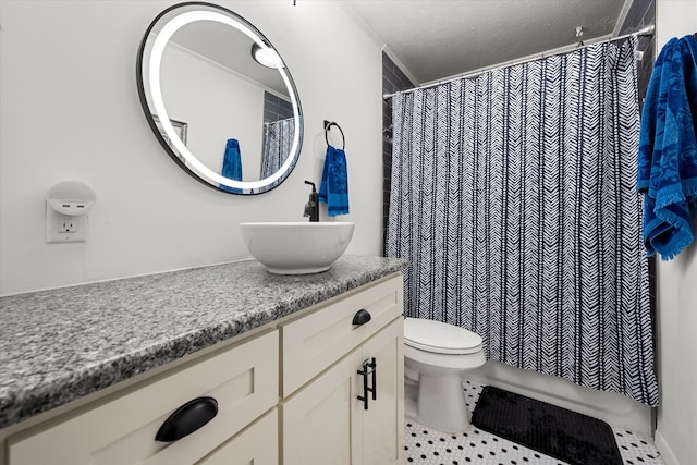 bathroom featuring tile patterned floors, vanity, toilet, and walk in shower