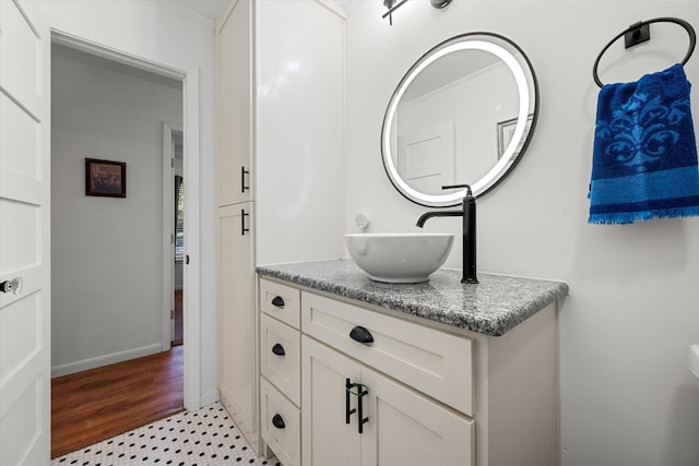 bathroom featuring hardwood / wood-style floors and vanity