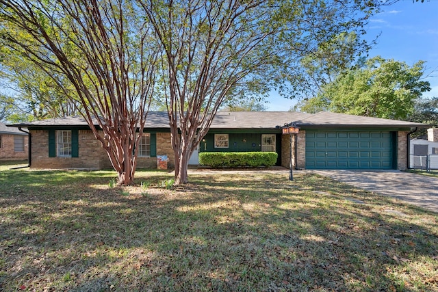 single story home featuring a garage and a front lawn