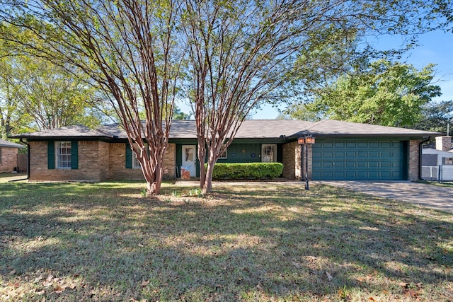 ranch-style house with a garage and a front lawn