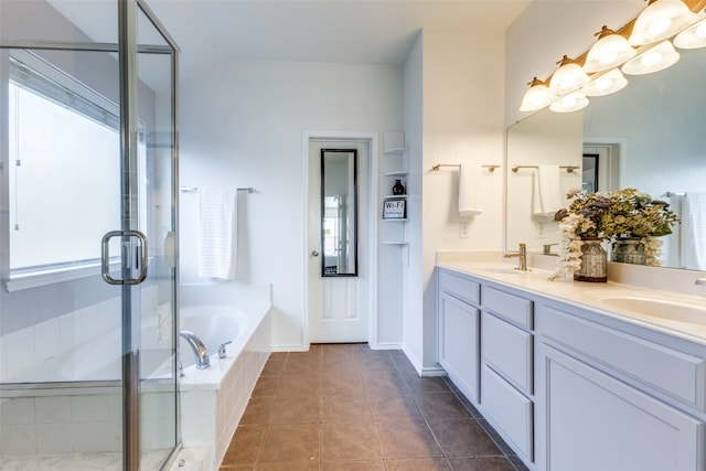 bathroom with tile patterned floors, vanity, and plus walk in shower