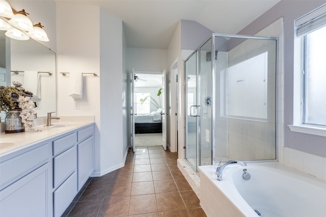 bathroom with tile patterned floors, a wealth of natural light, and ceiling fan