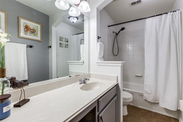 full bathroom featuring tile patterned floors, vanity, shower / tub combo, and toilet