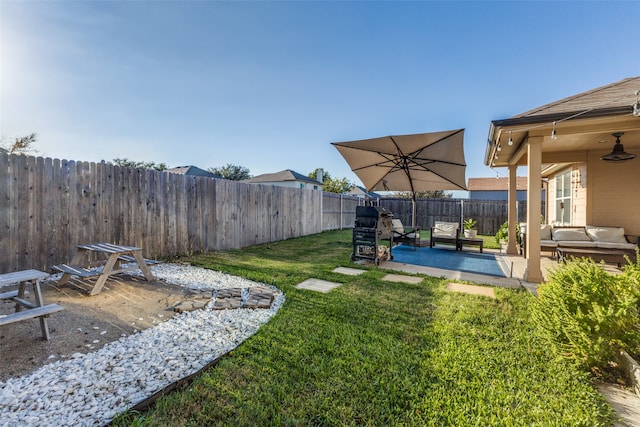 view of yard with outdoor lounge area and a patio area