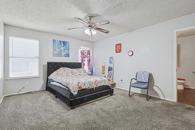 carpeted bedroom featuring ceiling fan, a textured ceiling, and connected bathroom