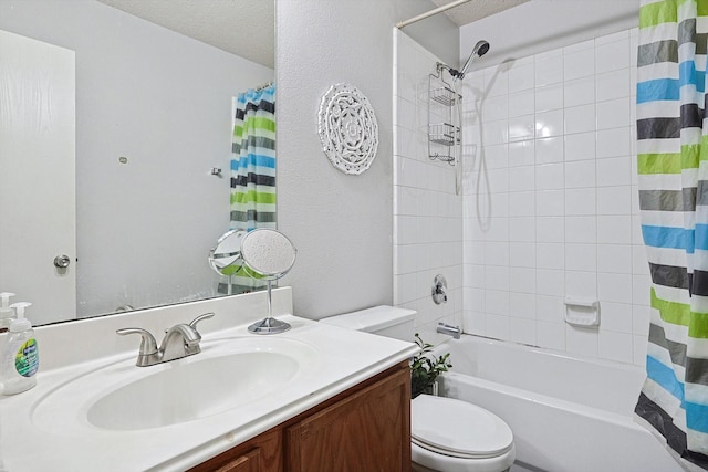 full bathroom with shower / bath combo with shower curtain, vanity, a textured ceiling, and toilet