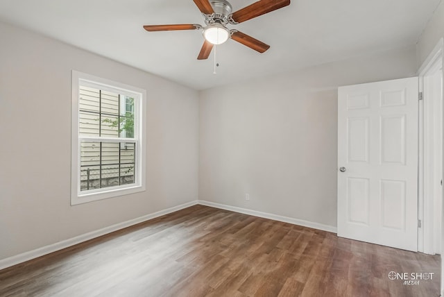 spare room featuring hardwood / wood-style floors and ceiling fan