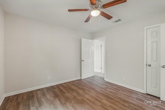 unfurnished bedroom featuring hardwood / wood-style flooring and ceiling fan