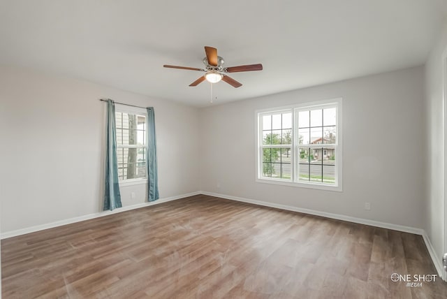 empty room featuring light hardwood / wood-style floors and ceiling fan