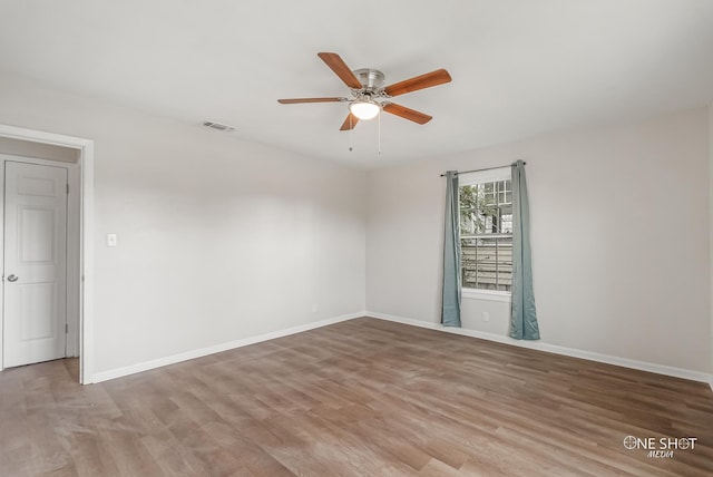 spare room featuring ceiling fan and light wood-type flooring