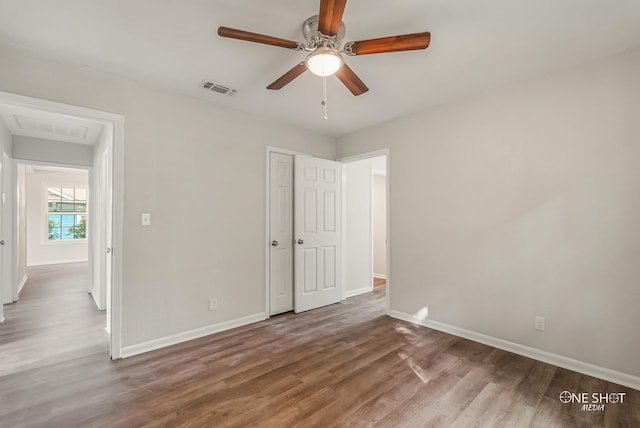 unfurnished bedroom featuring ceiling fan and wood-type flooring