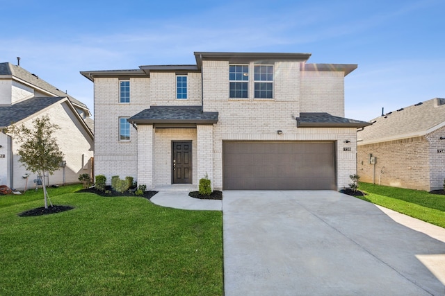 view of front of house with a front lawn and a garage