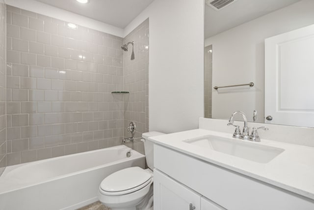 full bathroom with vanity, toilet, and tiled shower / bath